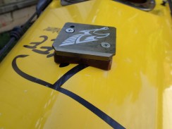 a close-up of the Falcon Sail mast plate adapter block showing misalignment