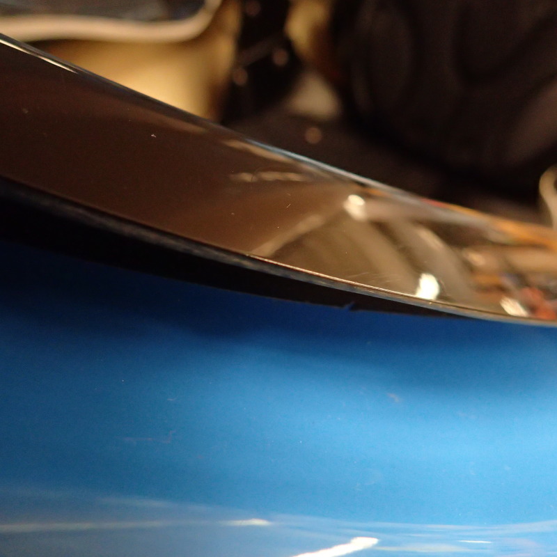 A close up showing the sharp edge of a kayak's cockpit coaming