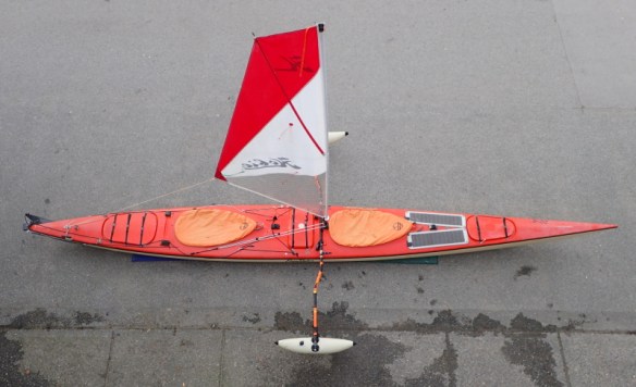 double kayak fitted with Hobie Mirage sail and Sidekick amas