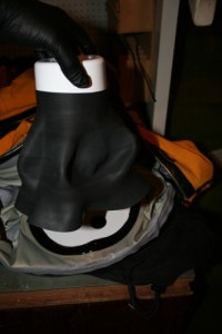 lowering the new neck seal into place