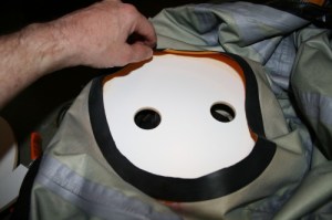 sticking down the neck area of the drysuit