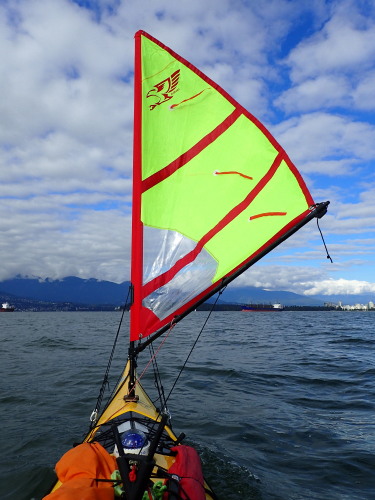 a sail on the front of a sea kayak