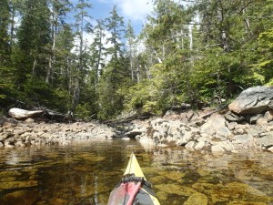 View of a creek over the bow of sea kayak