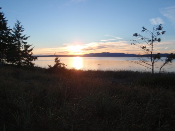 a sunset seen across the water