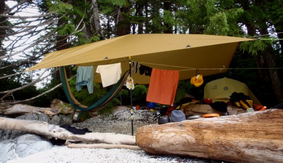 clothes drying under the shelter of a camp tarp