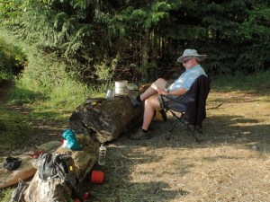 a camper lounges in a beach chair