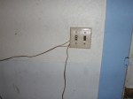 a light switch with wiring running outside the switch