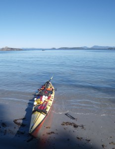 A sea kayak pulled up on the beach, Dufferin Island, BC