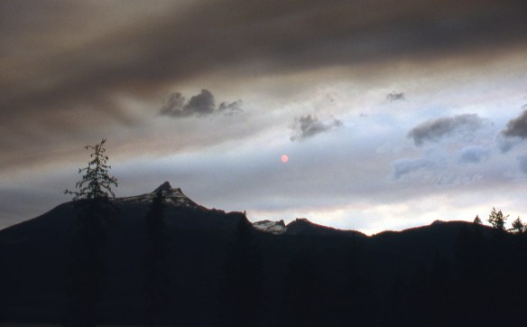 a storm-darkened sky in the mountains above Slocan Lake, BC